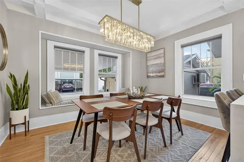 a kitchen with a dining table and chairs