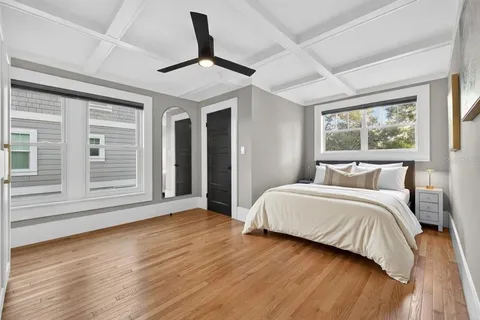 a view of a room with wooden floor and shelf