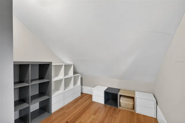 a bedroom with a bed a window and couch