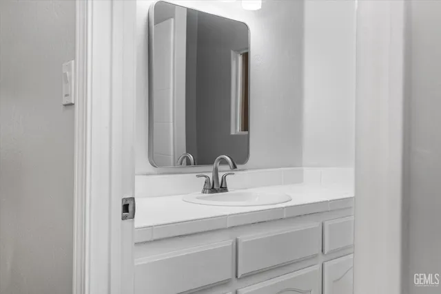 a bathroom with a sink and a mirror