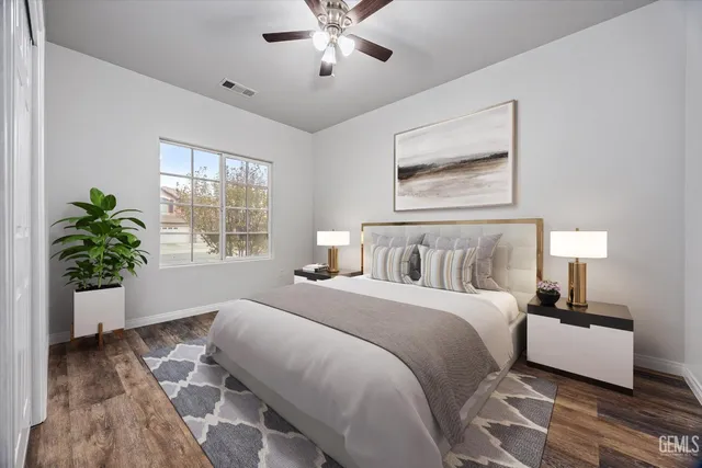 a bedroom with bed and window