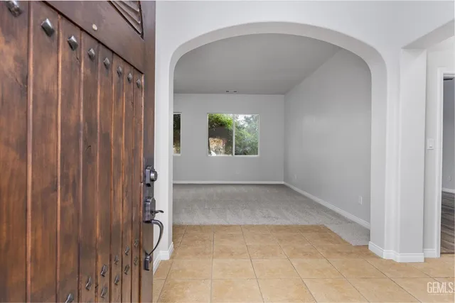 a view of an empty room with windows