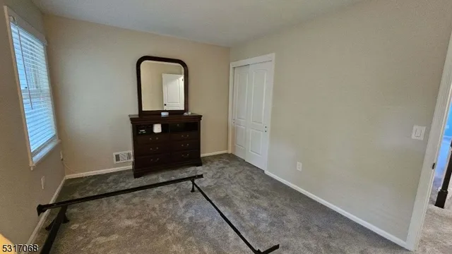 a view of a livingroom with wooden floor