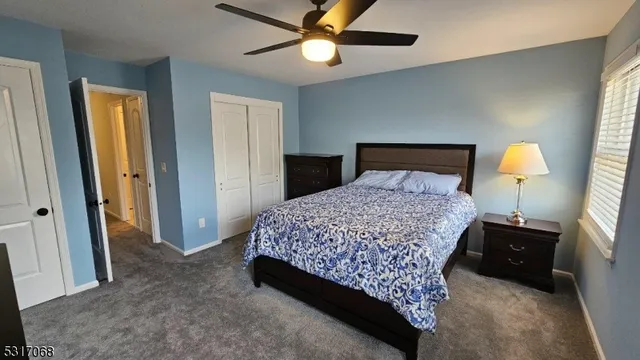 a bedroom with a bed and a lamp