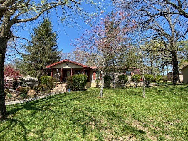 751 Monroe Floyd Road Decherd, TN 37324 - Photo 2 of 38 a view of a house with a yard