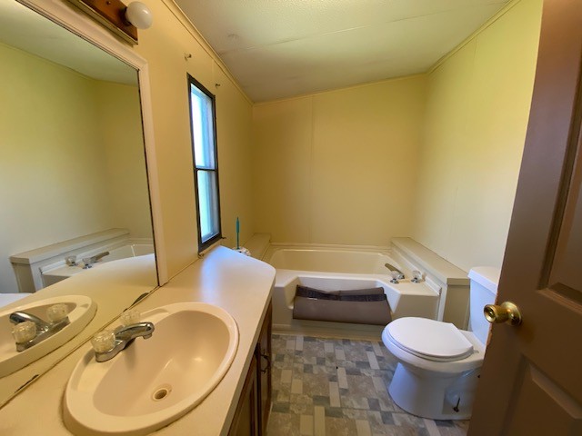 751 Monroe Floyd Road Decherd, TN 37324 - Photo 11 of 38 a bathroom with a sink and a mirror