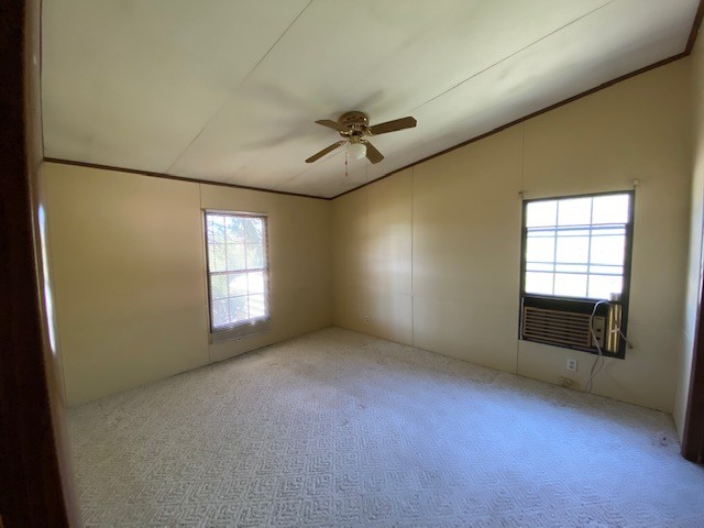 751 Monroe Floyd Road Decherd, TN 37324 - Photo 12 of 38 an empty room with windows and ceiling fan