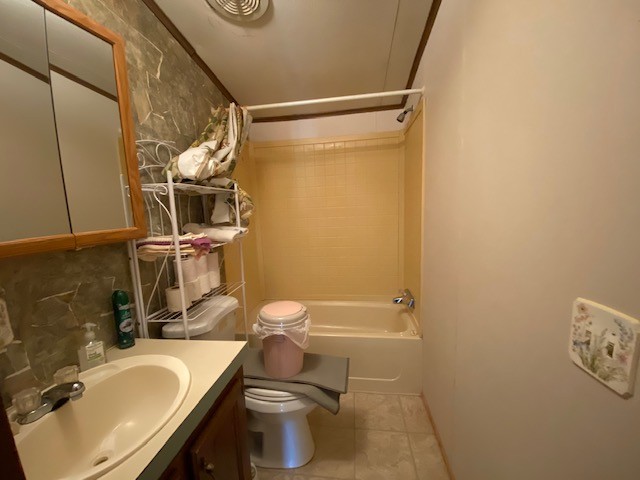 751 Monroe Floyd Road Decherd, TN 37324 - Photo 13 of 38 a bathroom with a sink a toilet and shower