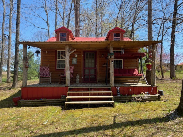 751 Monroe Floyd Road Decherd, TN 37324 - Photo 24 of 38 a view of a building with door open porch