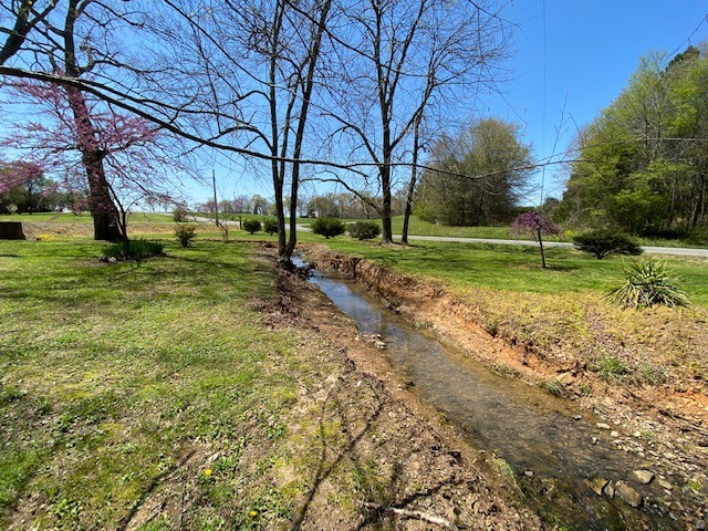 751 Monroe Floyd Road Decherd, TN 37324 - Photo 27 of 38 a view of a backyard with large trees