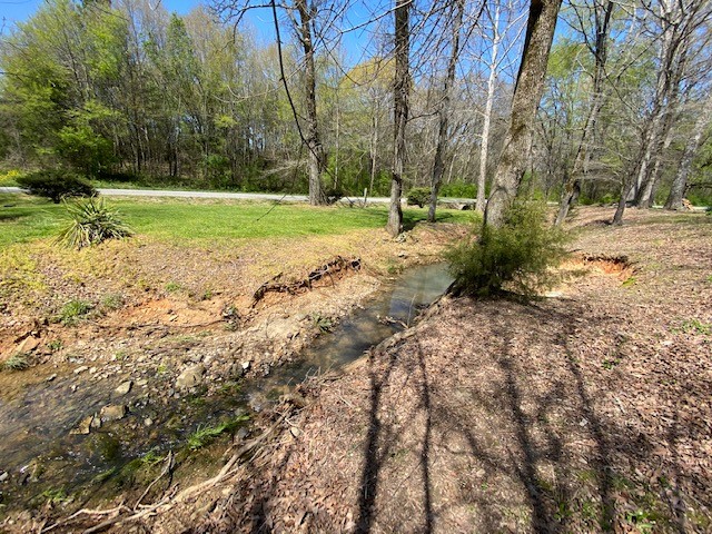 751 Monroe Floyd Road Decherd, TN 37324 - Photo 28 of 38 a view of a field with trees in the background