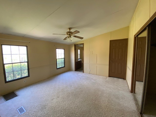 751 Monroe Floyd Road Decherd, TN 37324 - Photo 10 of 38 an empty room with windows and closet