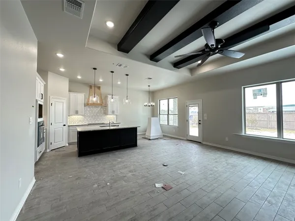 a large spacious bathroom with a large tub and sink