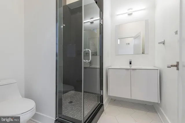 a bathroom with a shower and toilet