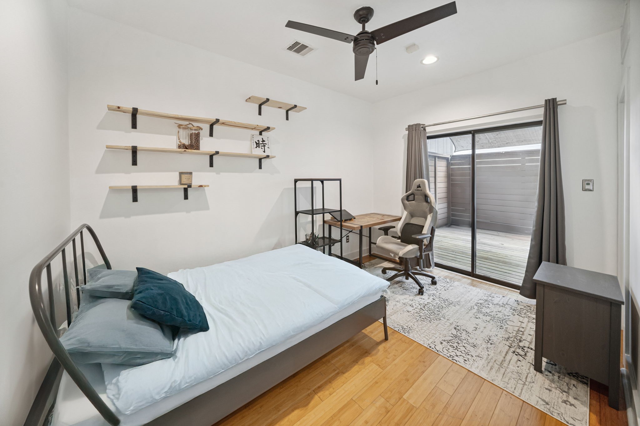 2010 Blodgett Street, Unit G Houston, TX 77004 - Photo 15 of 31 a bedroom with a bed a table and chairs