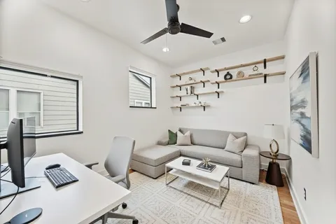 a living room with furniture and a window