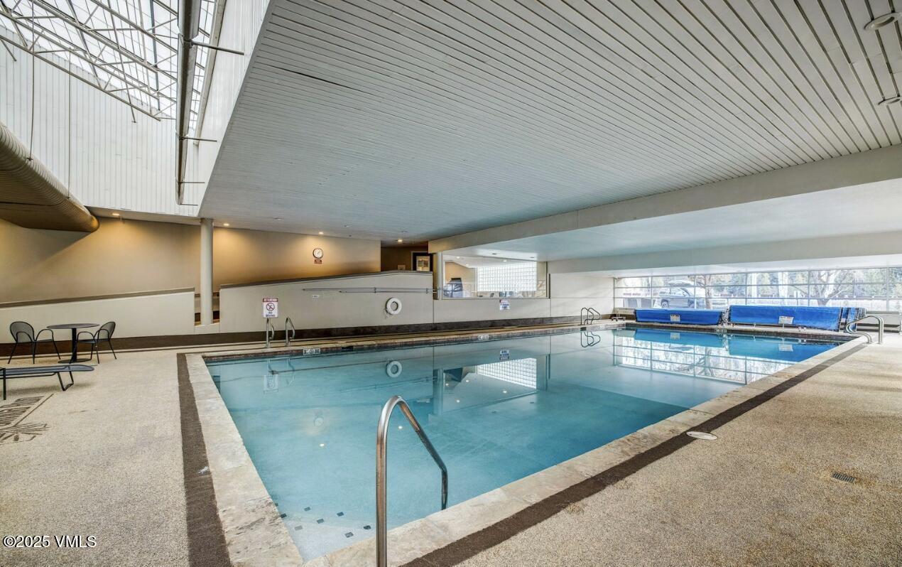 1100 North Frontage Road West, Unit 2401 Vail, CO 81657 - Photo 14 of 29 a view of a kitchen with a table and chairs