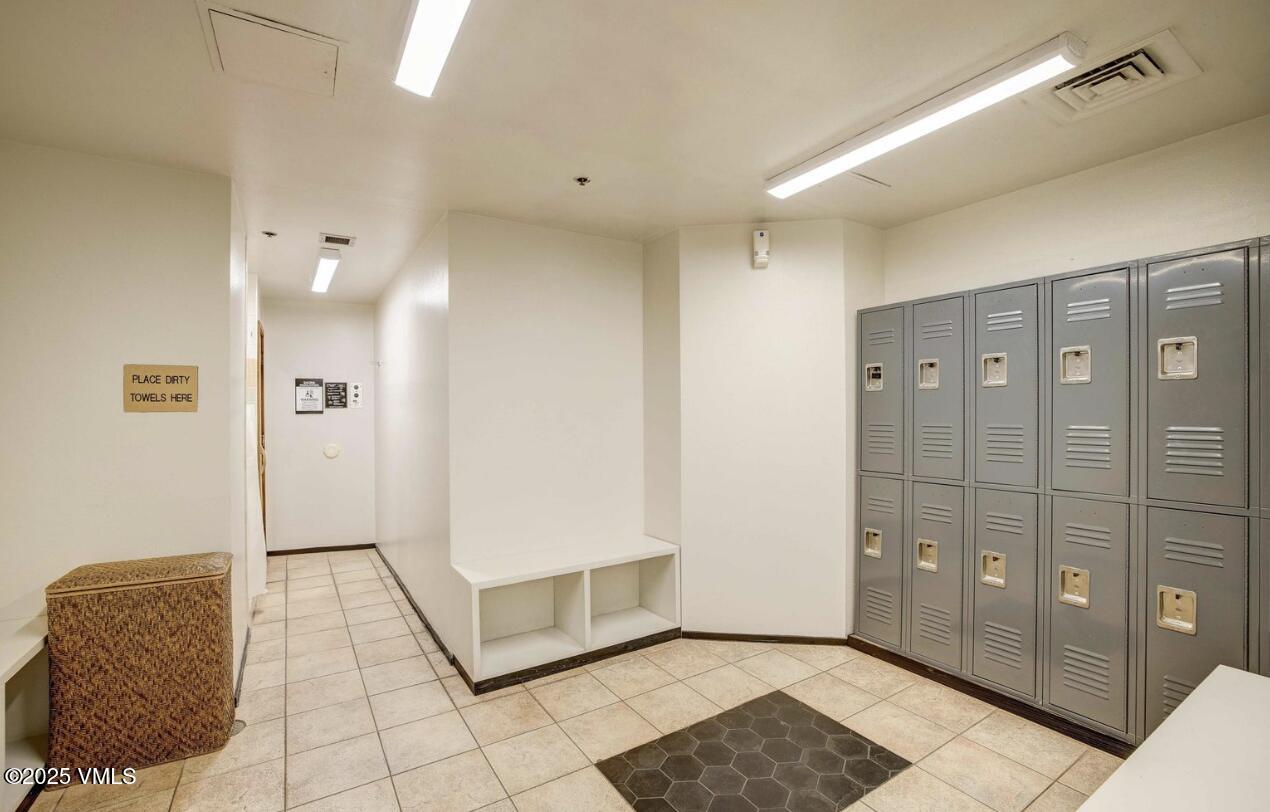 1100 North Frontage Road West, Unit 2401 Vail, CO 81657 - Photo 21 of 29 a view of a hallway with closet and bathroom