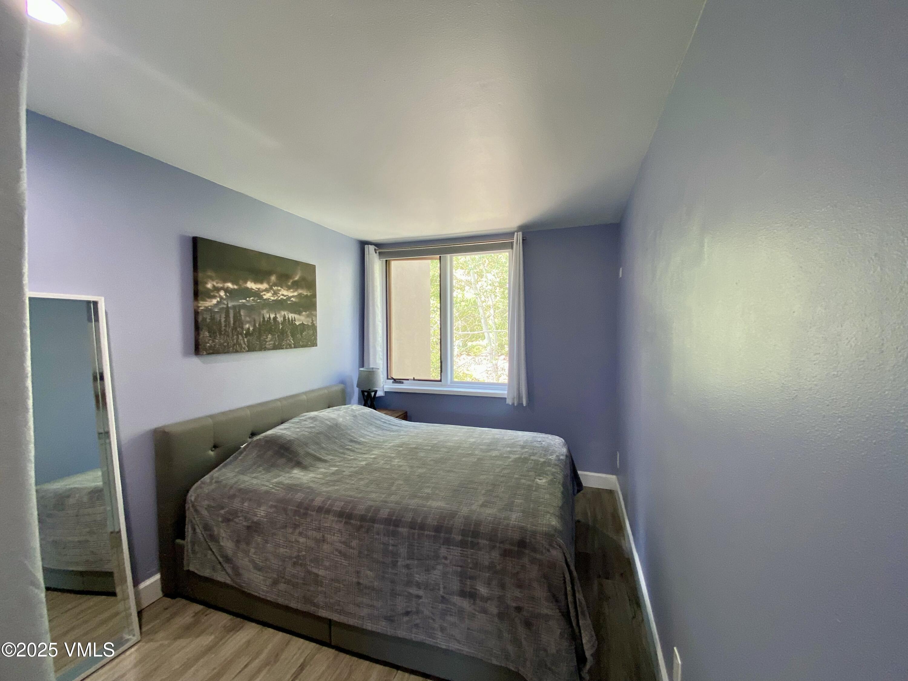 1100 North Frontage Road West, Unit 2401 Vail, CO 81657 - Photo 5 of 29 a bedroom with a bed and a window
