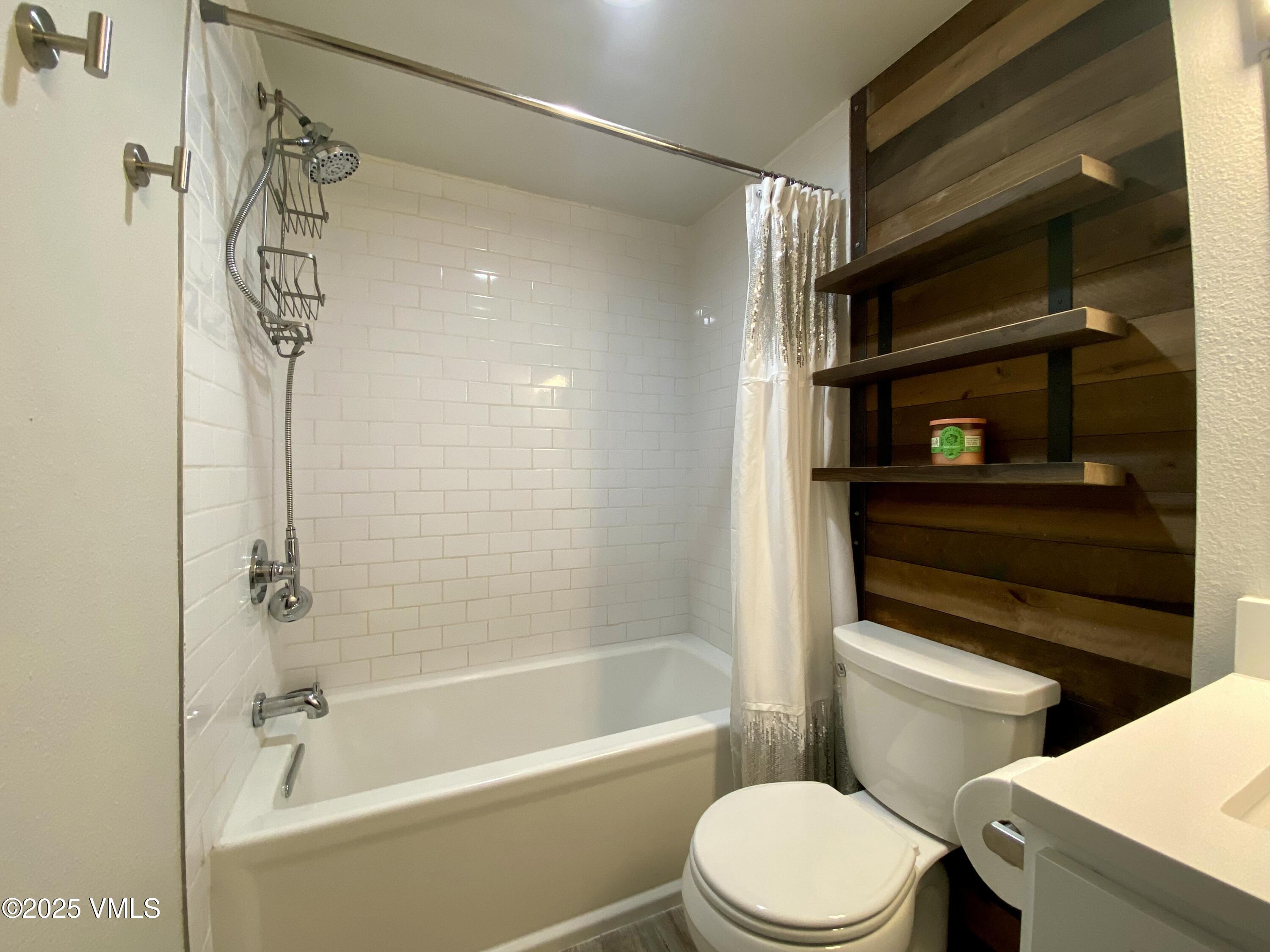 1100 North Frontage Road West, Unit 2401 Vail, CO 81657 - Photo 7 of 29 a bathroom with a shower a toilet and a bathtub