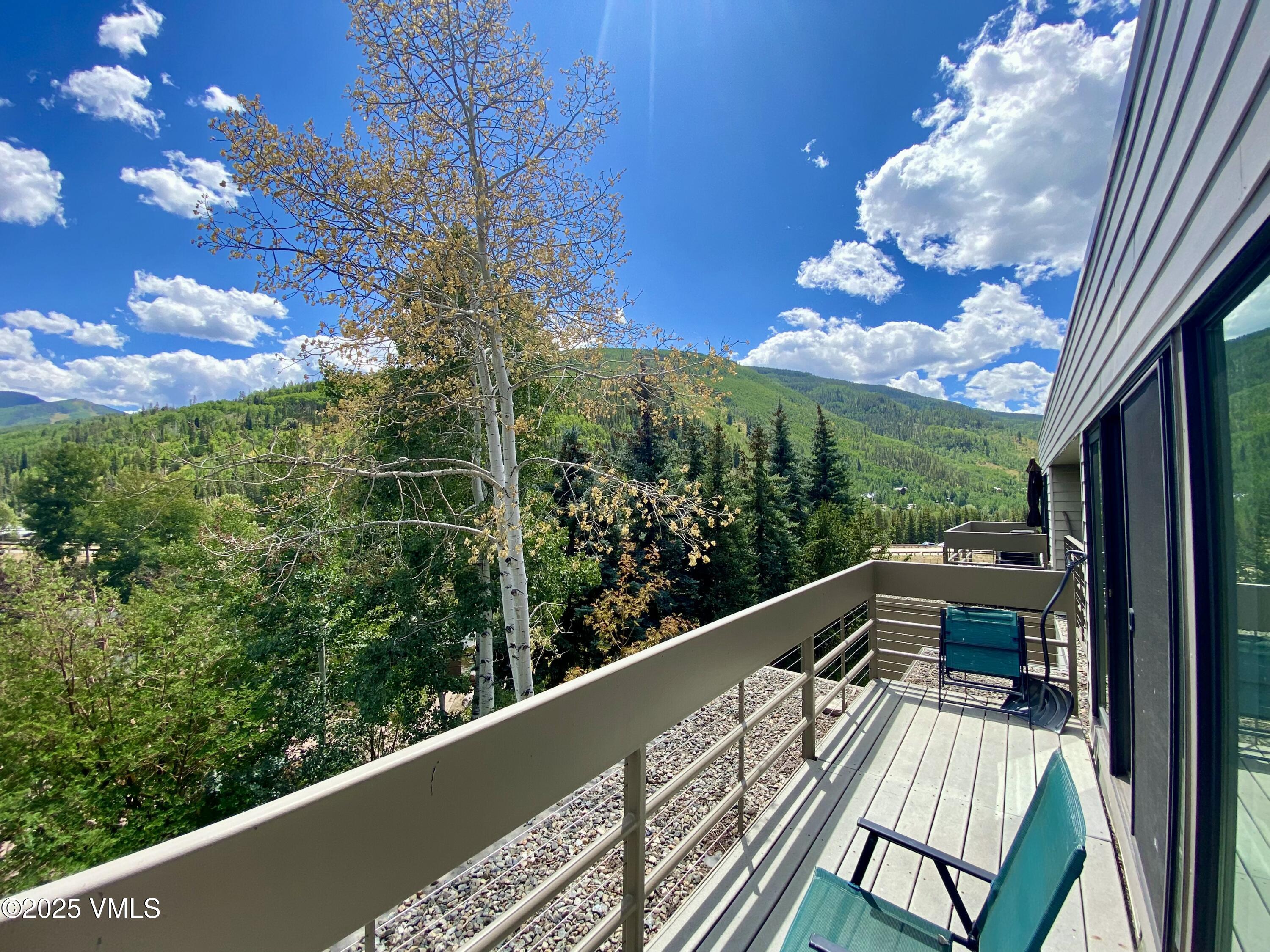 1100 North Frontage Road West, Unit 2401 Vail, CO 81657 - Photo 9 of 29 a view of balcony with wooden floor