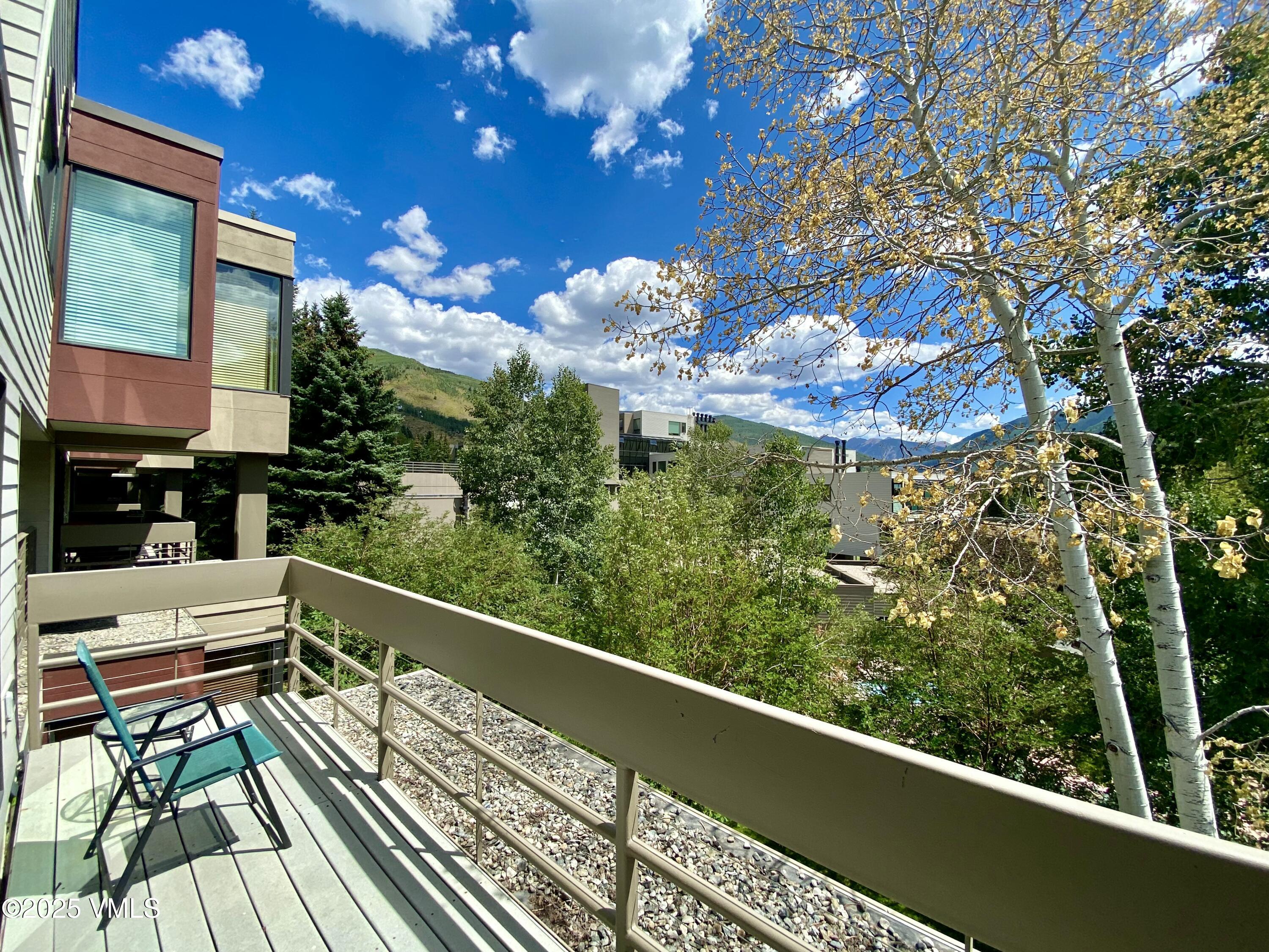 1100 North Frontage Road West, Unit 2401 Vail, CO 81657 - Photo 10 of 29 a view of a balcony with wooden floor