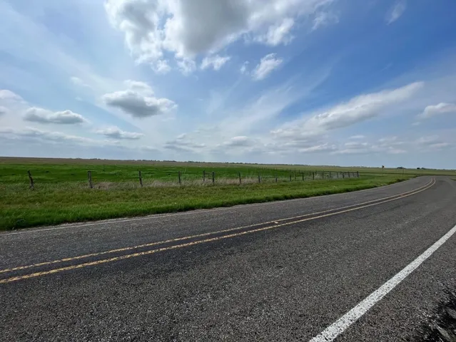 a view of a road with an ocean view