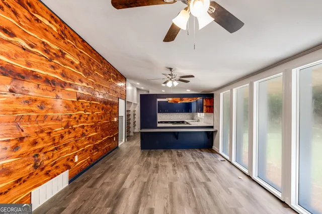 a kitchen with stainless steel appliances a stove top oven a sink and a refrigerator