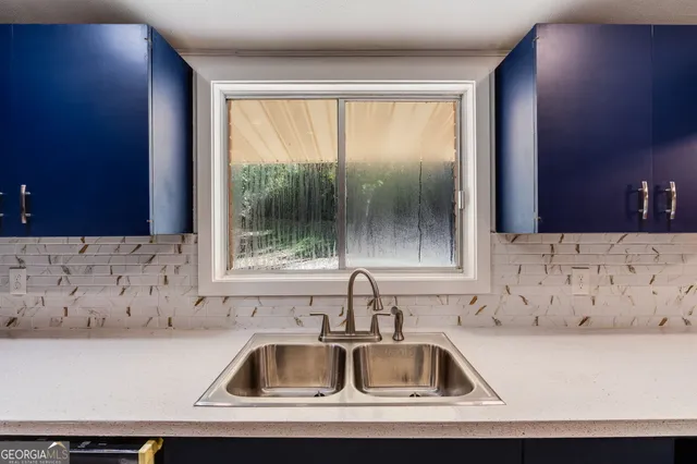 a kitchen sink with a window