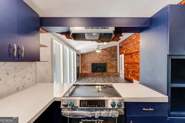 a view of living room with furniture and flat screen tv