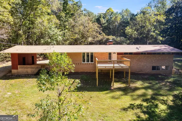 a balcony with table and chairs
