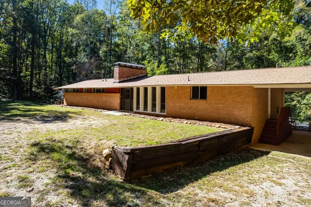 a view of a backyard with chairs
