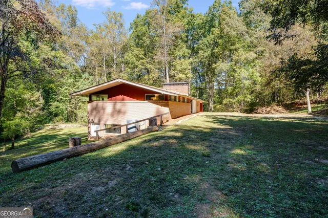 a backyard of a house with lots of green space