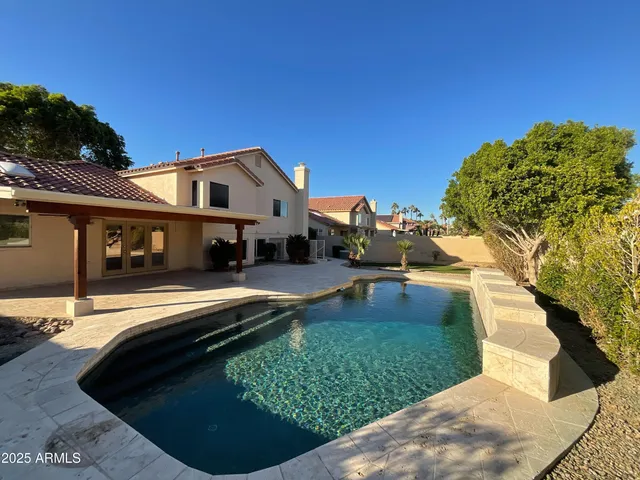 a view of a house with a snow in the yard