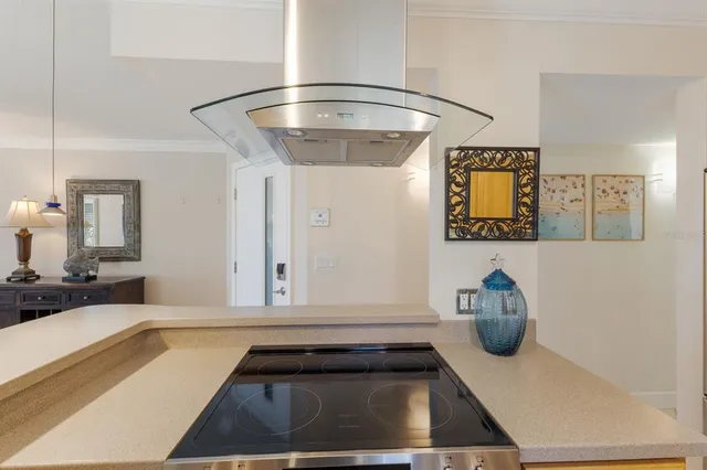 a kitchen with a sink and a stove top oven