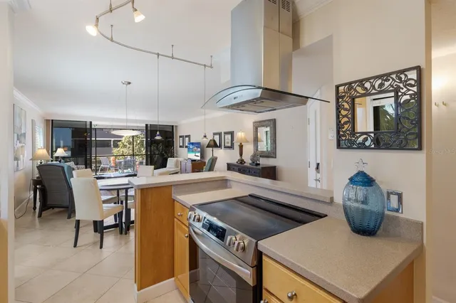 a kitchen with a stove and a refrigerator