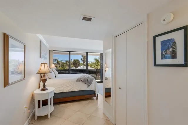 a bed room with furniture and a window