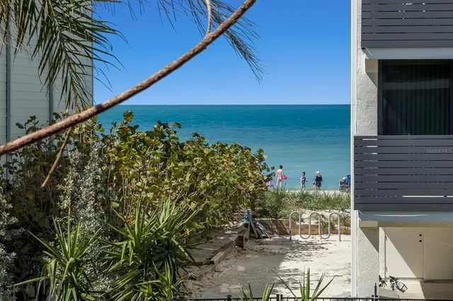 a view of swimming pool with outdoor seating and yard