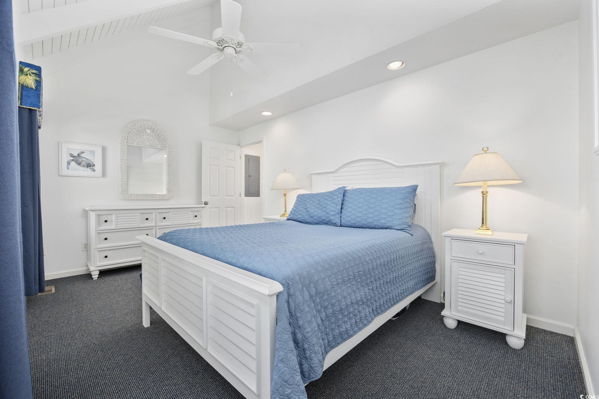 27 Riptide Lane Pawleys Island, SC 29585 - Photo 19 of 40 Bedroom featuring dark colored carpet, a ceiling fan, beamed ceiling, and high vaulted ceiling