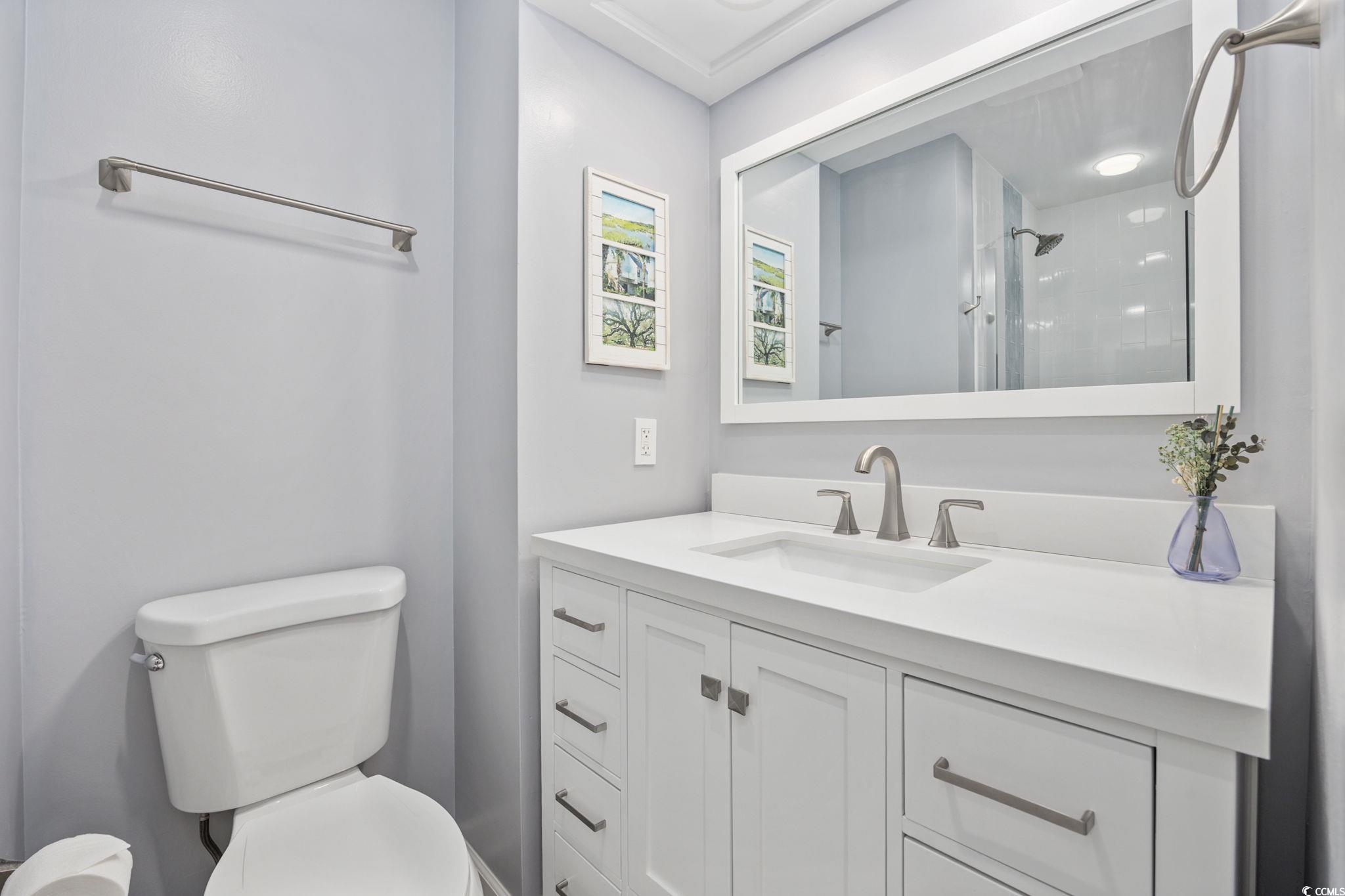 27 Riptide Lane Pawleys Island, SC 29585 - Photo 20 of 40 Full bathroom with vanity and a shower