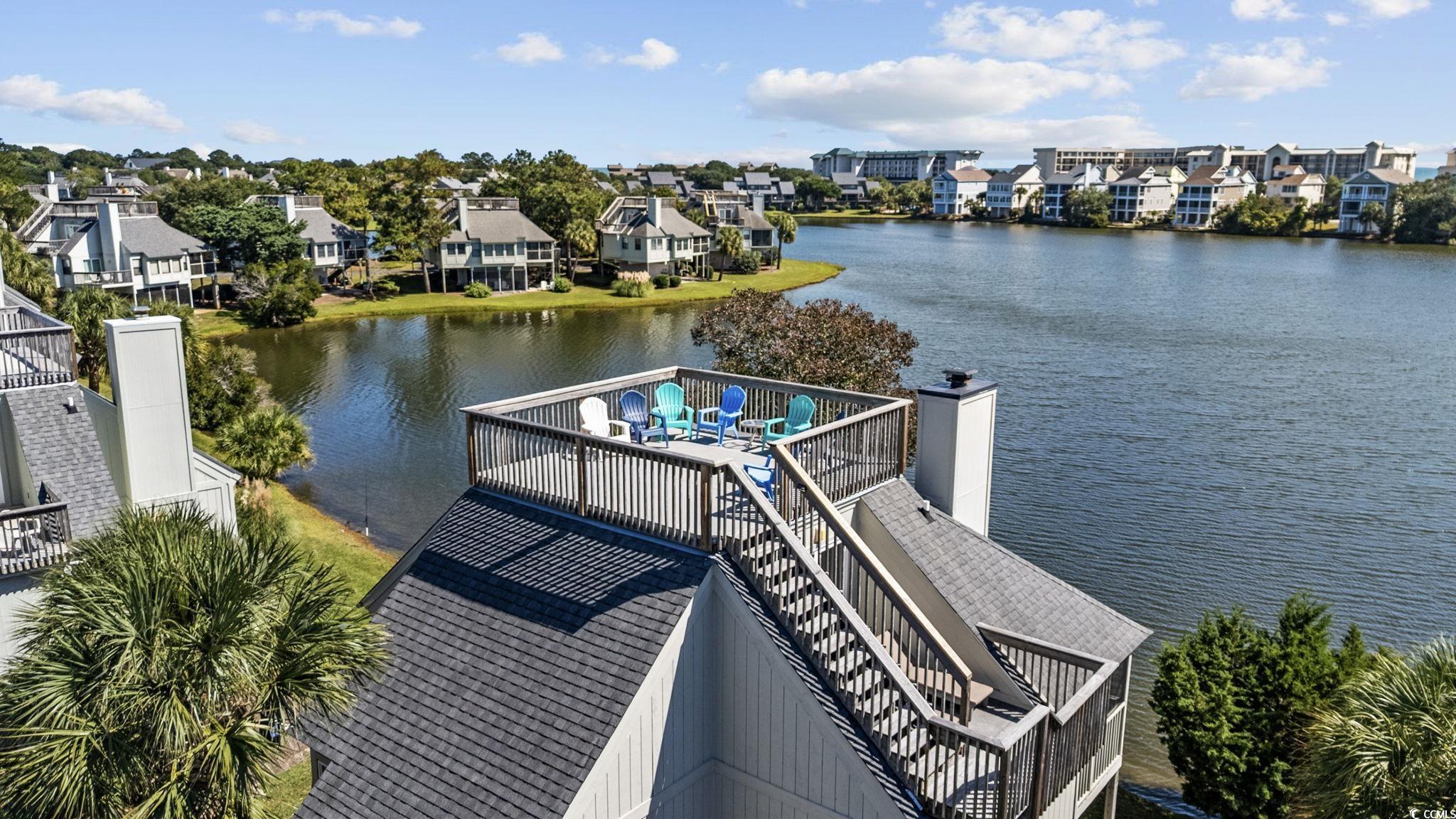 27 Riptide Lane Pawleys Island, SC 29585 - Photo 24 of 40 Dock area featuring a deck with water view and a residential view