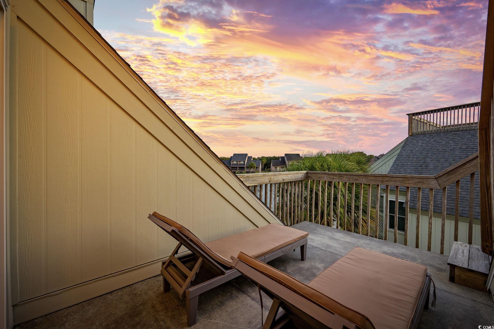 27 Riptide Lane Pawleys Island, SC 29585 - Photo 25 of 40 View of balcony at dusk