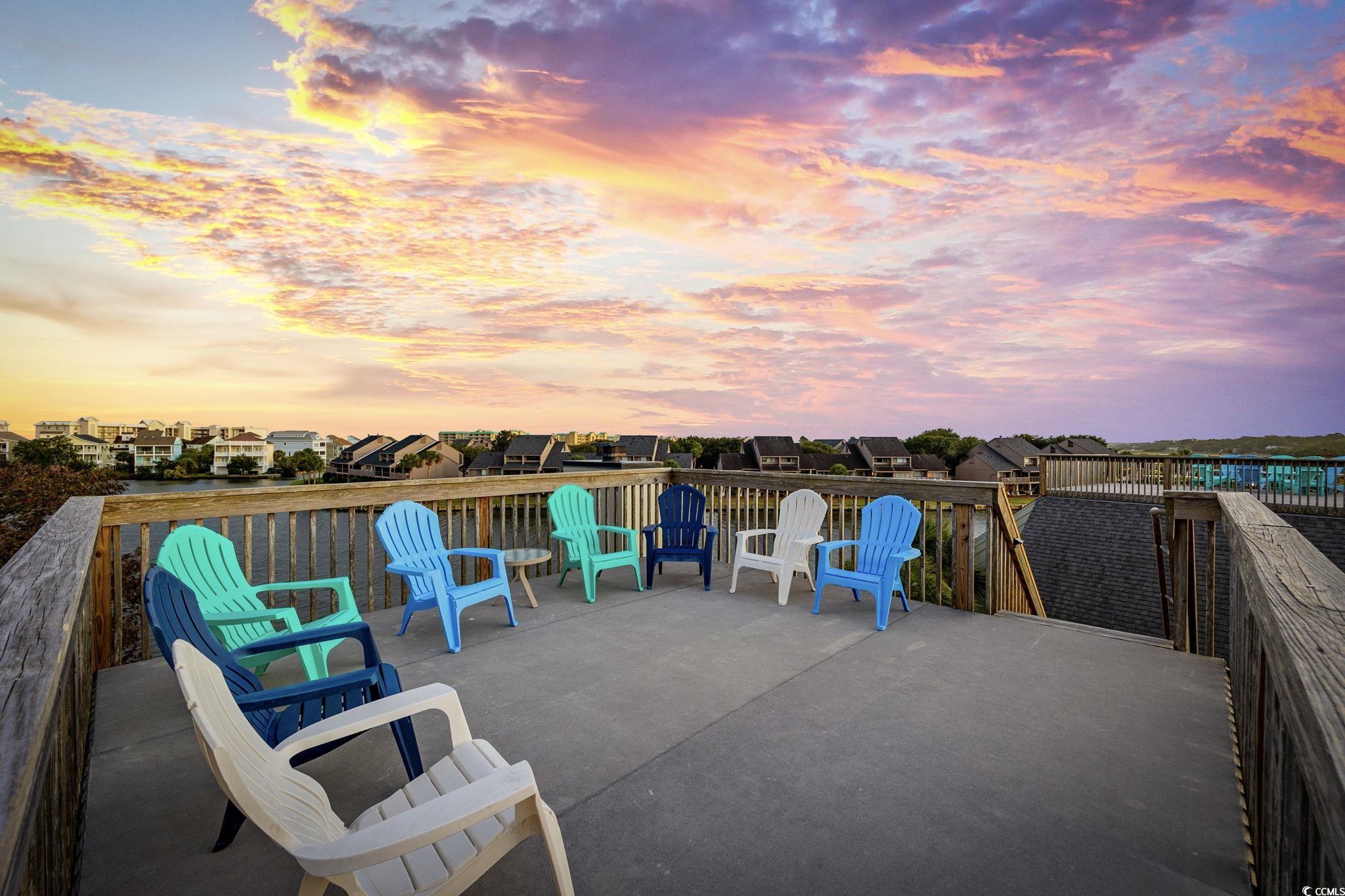 27 Riptide Lane Pawleys Island, SC 29585 - Photo 26 of 40 Patio terrace at dusk with a patio area and a residential view