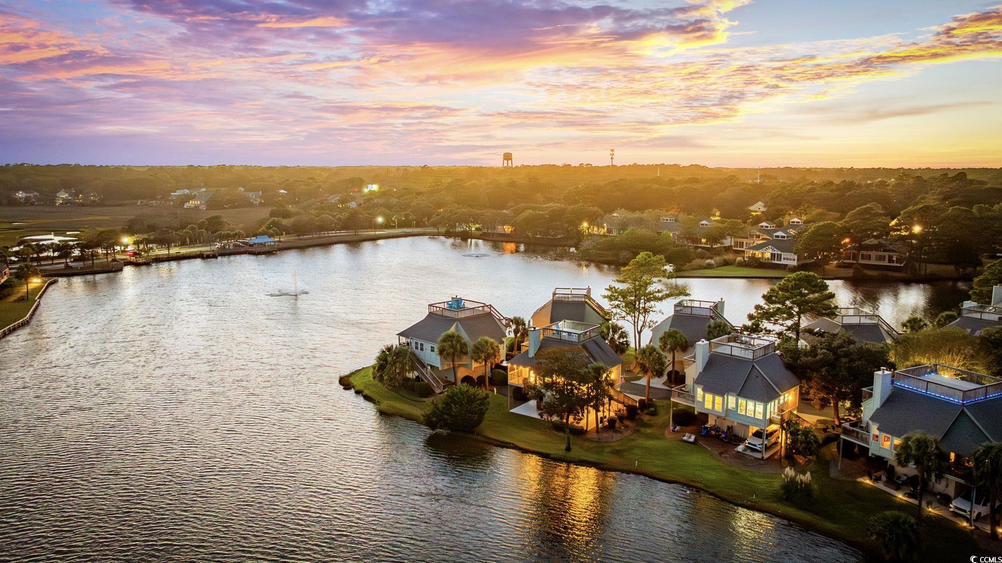 27 Riptide Lane Pawleys Island, SC 29585 - Photo 31 of 40 Aerial perspective of suburban area with a large body of water