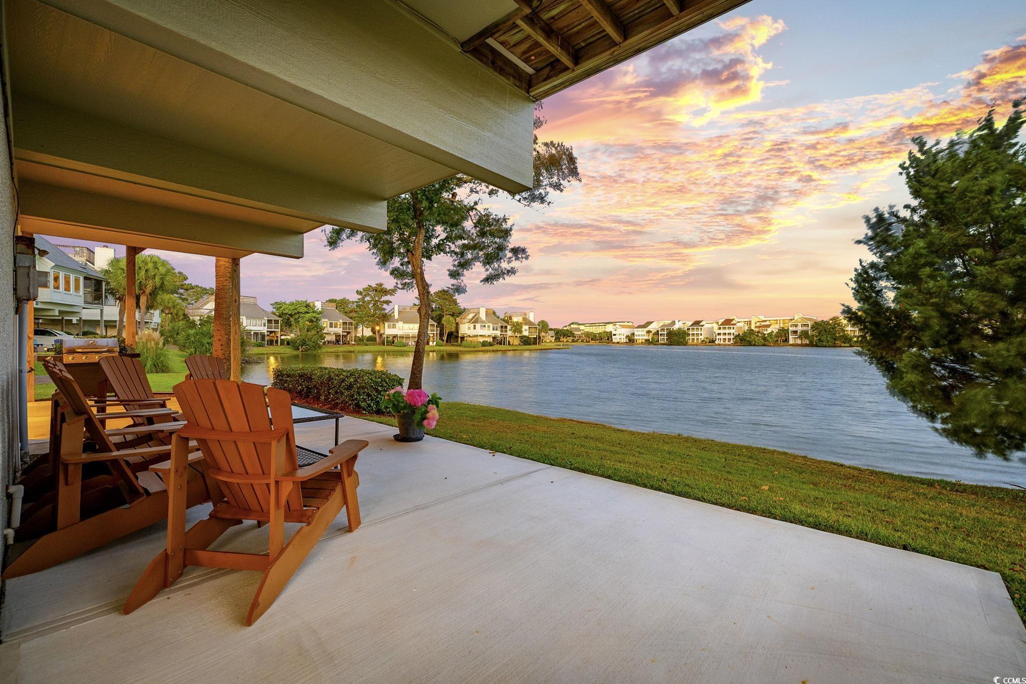 27 Riptide Lane Pawleys Island, SC 29585 - Photo 33 of 40 View of patio featuring a water view and a residential view