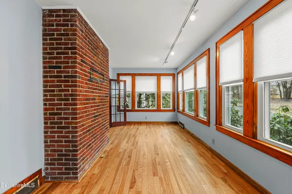 a view of balcony with wooden floor