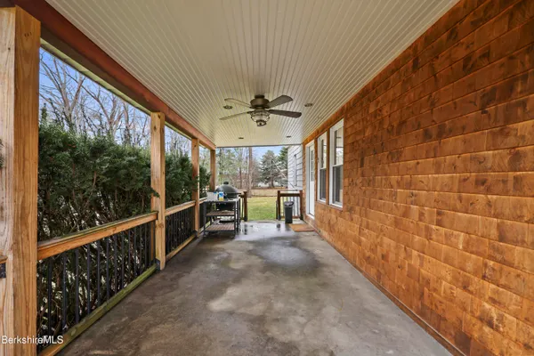 a view of house with a yard and garage