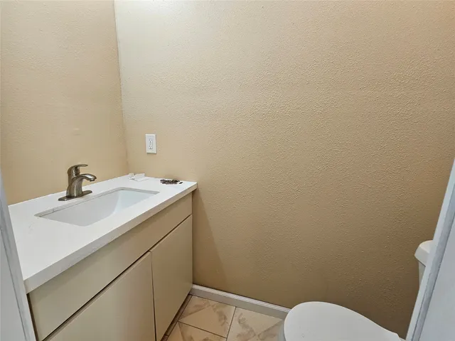 a bathroom with a sink and a toilet
