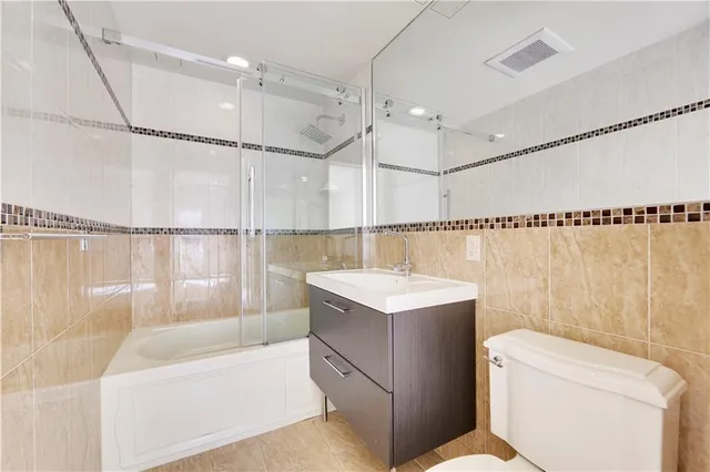 a bathroom with a sink a toilet and a bathtub