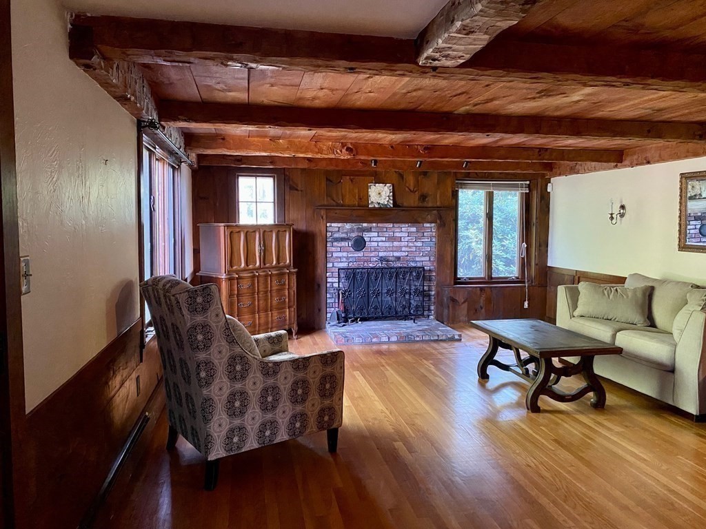 103 Clapp Road Scituate, MA 02066 - Photo 13 of 27 a living room with furniture and a wooden floor
